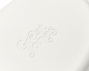 Enameled cast-iron Dutch oven in salt white - logo close-up