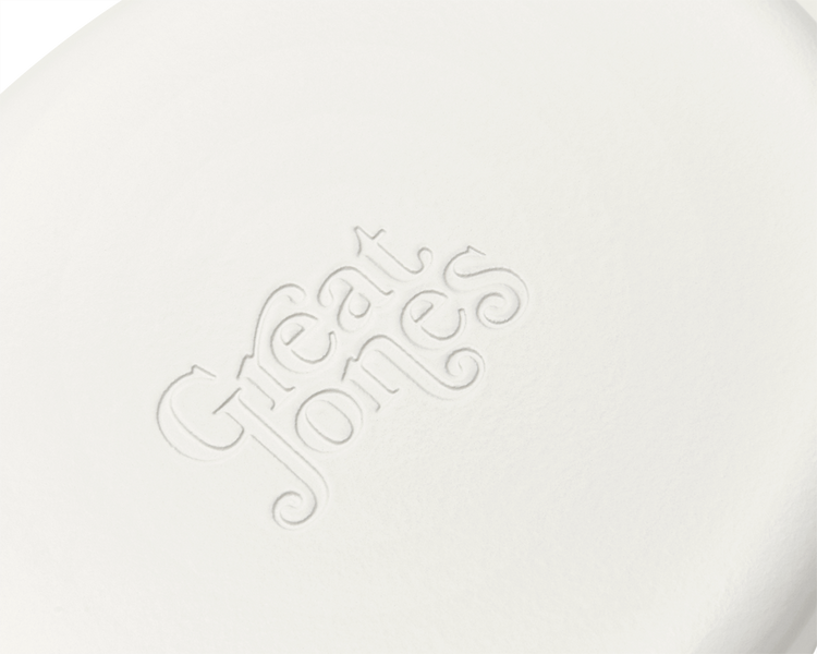 Enameled cast-iron Dutch oven in salt white - logo close-up